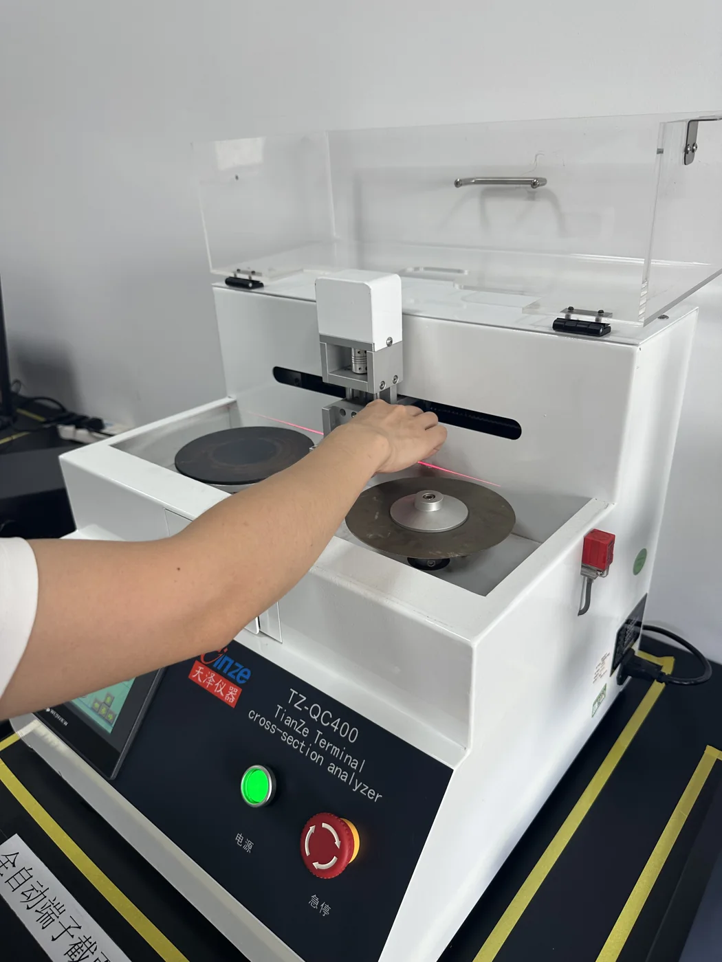 Operator preparing a terminal cross-section sample