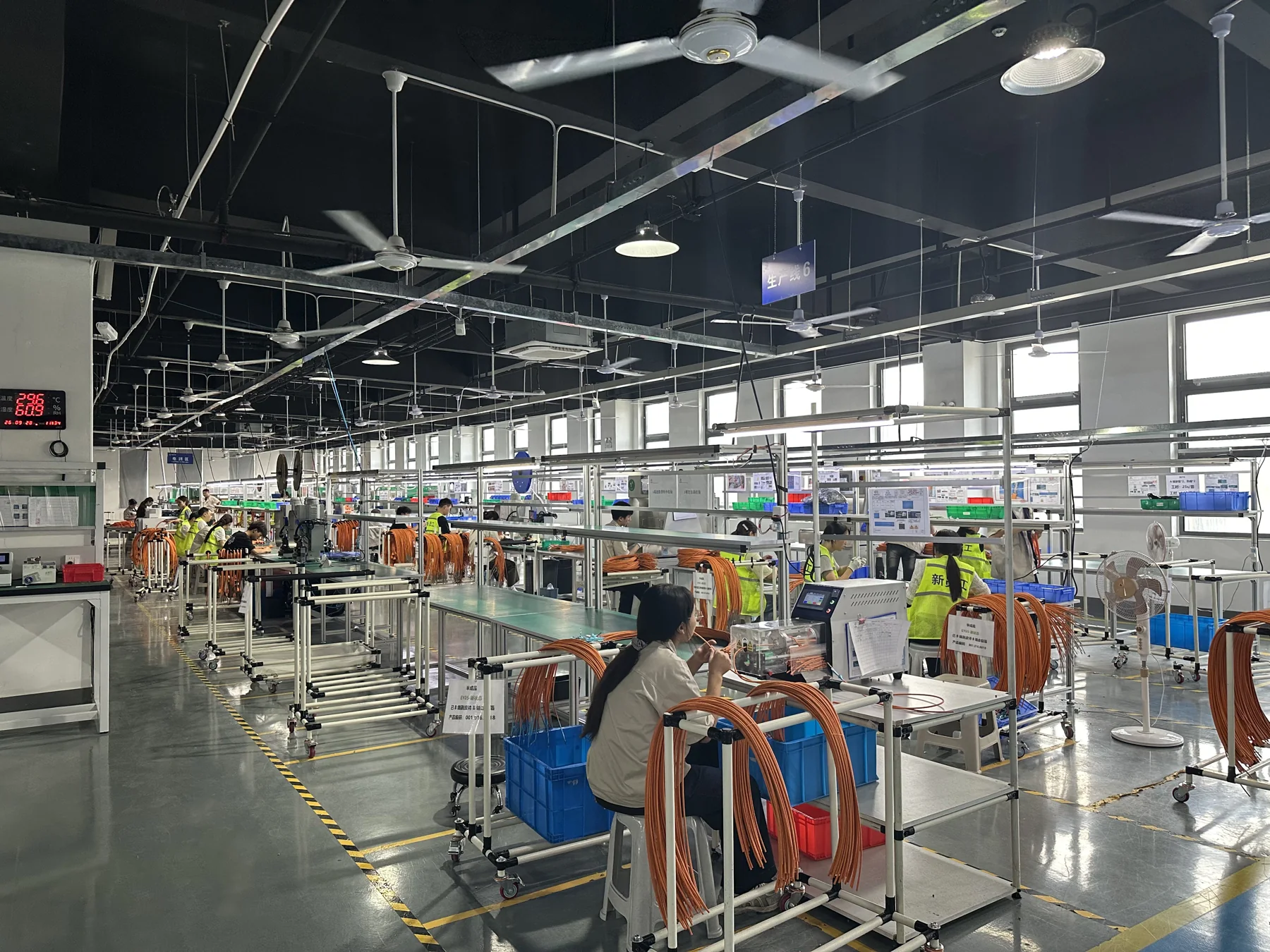 Henryun production floor with multiple harness processing workstations